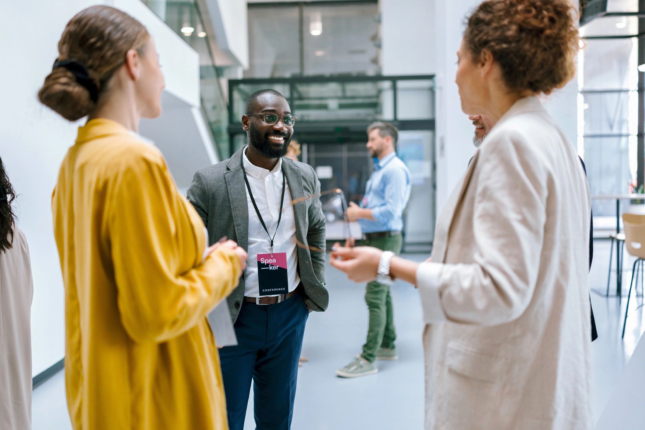 Professional leaders in conversation before an event